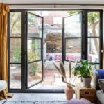 french doors opening onto urban courtyard garden