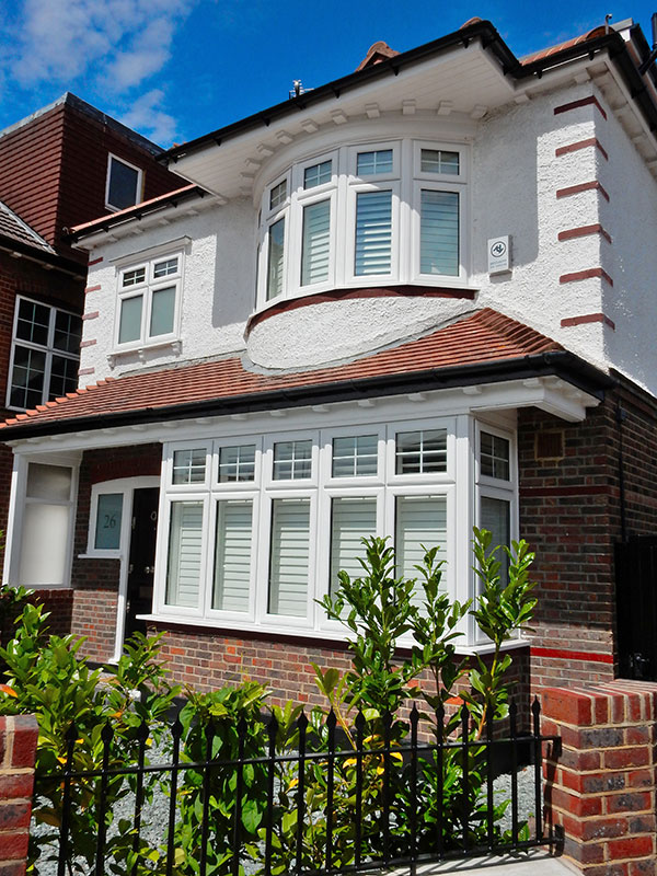 white upvc lipped casement windows on a smart suburban house